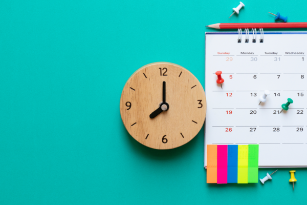 a calendar with important and urgent tasks, and a clock
