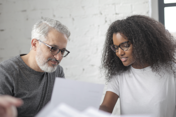 Two people discussing effective negotiation practices